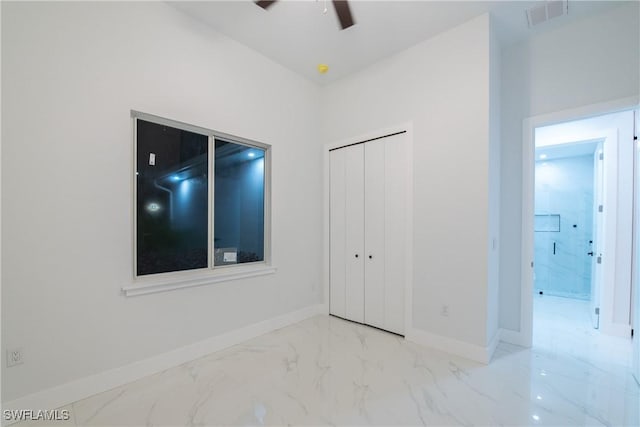 unfurnished bedroom with a closet and ceiling fan