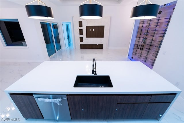 kitchen with pendant lighting, sink, and stainless steel dishwasher