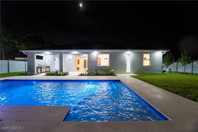 pool at twilight with a lawn