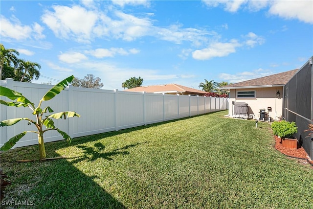 view of yard with a lanai