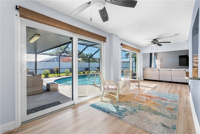 interior space featuring ceiling fan and light hardwood / wood-style flooring