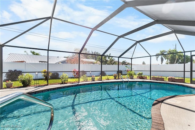 view of swimming pool with a patio and glass enclosure