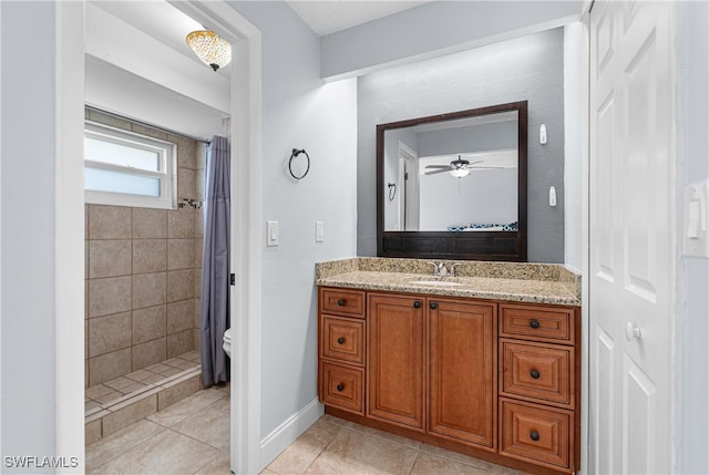 bathroom featuring vanity, curtained shower, tile patterned floors, and toilet