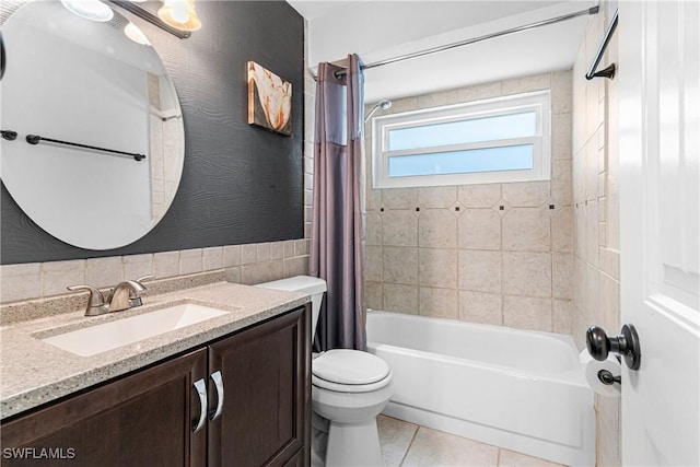 full bathroom featuring tile patterned flooring, vanity, shower / tub combo, and toilet