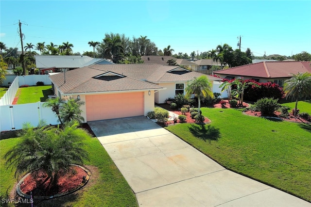 view of front facade with a garage and a front yard