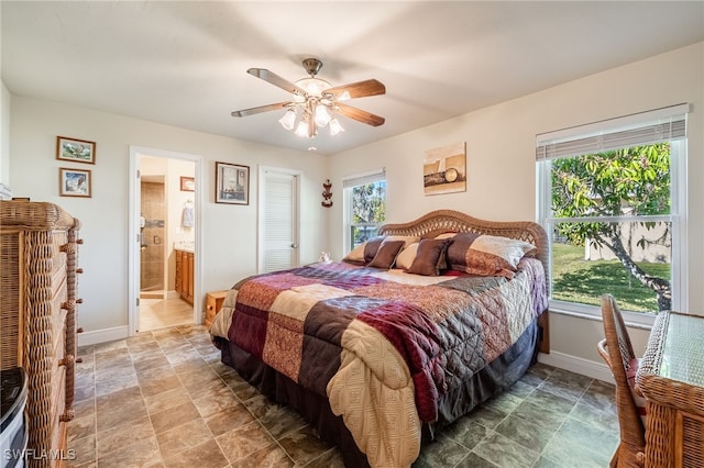 bedroom featuring ensuite bath and ceiling fan