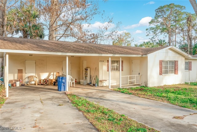 exterior space featuring a carport