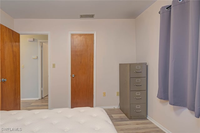 bedroom with light hardwood / wood-style floors