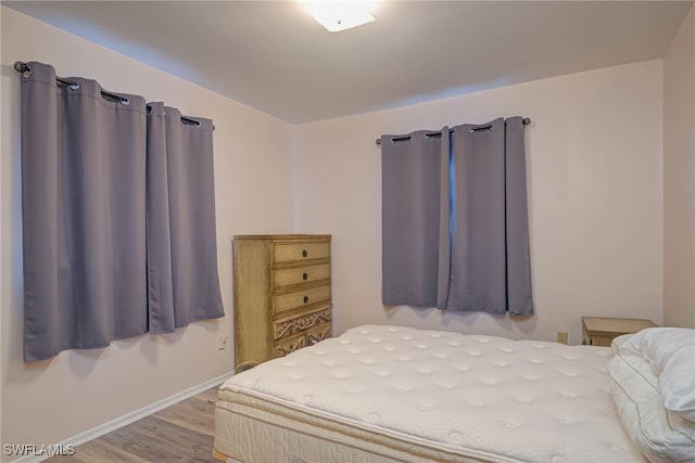 bedroom with light wood-type flooring