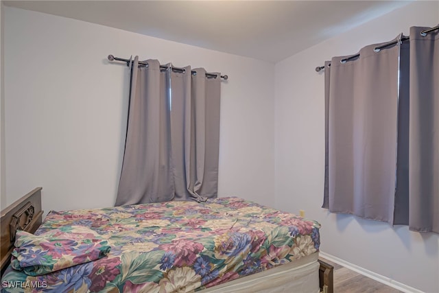 bedroom with light hardwood / wood-style floors