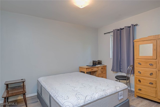 bedroom with light hardwood / wood-style floors