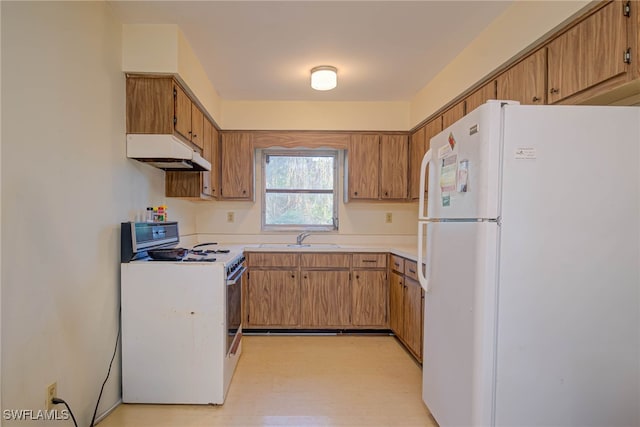 kitchen with sink and white appliances