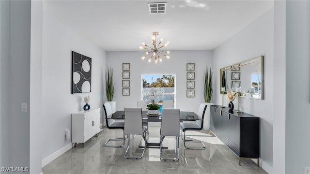 dining space featuring an inviting chandelier