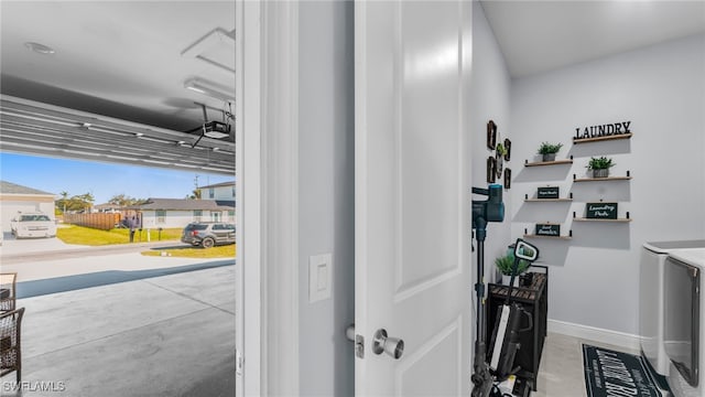 interior space featuring a garage door opener and washing machine and dryer