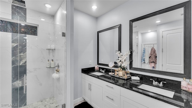 bathroom with an enclosed shower and vanity