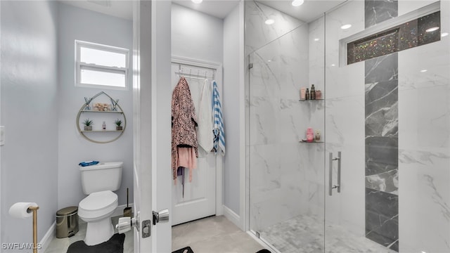 bathroom with walk in shower and toilet