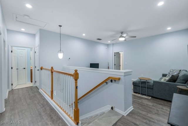 hallway with hardwood / wood-style floors