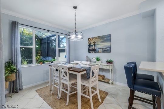 dining room featuring light tile patterned floors and crown molding