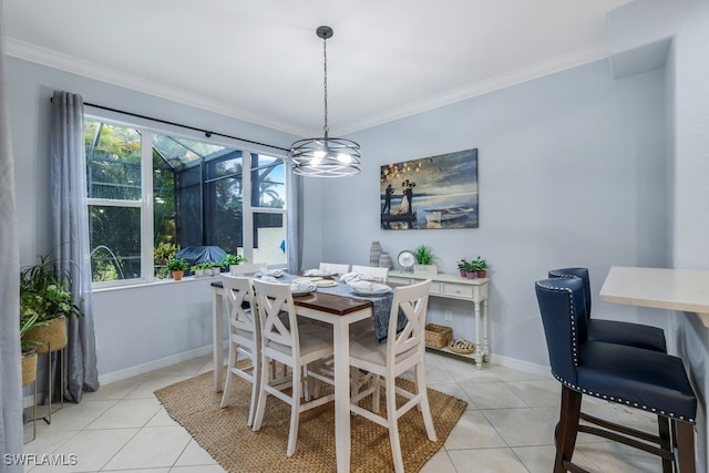 tiled dining room with a healthy amount of sunlight and ornamental molding