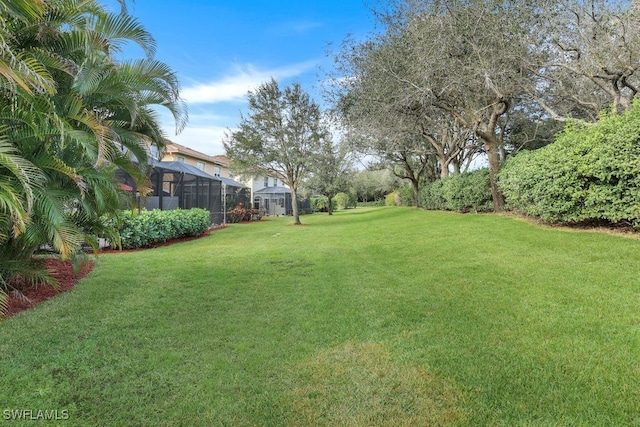 view of yard with a lanai