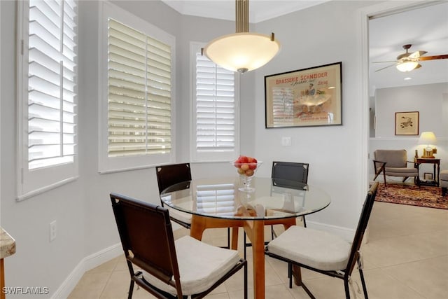 tiled dining room featuring ceiling fan