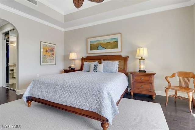 bedroom featuring dark wood-type flooring and ornamental molding