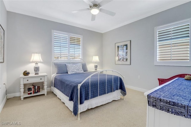 bedroom featuring crown molding, carpet flooring, and ceiling fan