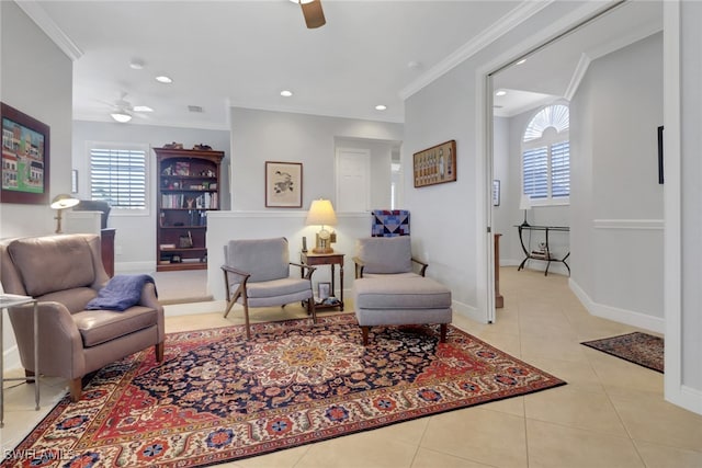 living room with light tile patterned floors, crown molding, and ceiling fan