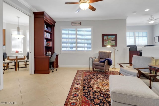 living area with crown molding, light tile patterned floors, and ceiling fan