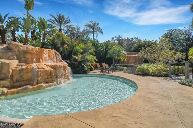 view of swimming pool with a patio area