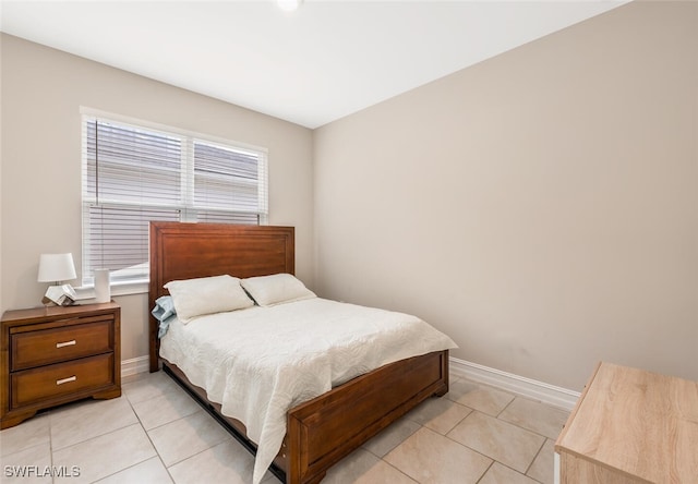 bedroom with light tile patterned flooring