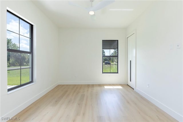 spare room featuring light hardwood / wood-style floors