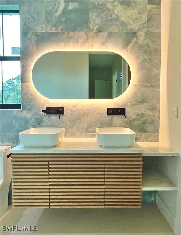 bathroom with vanity and backsplash