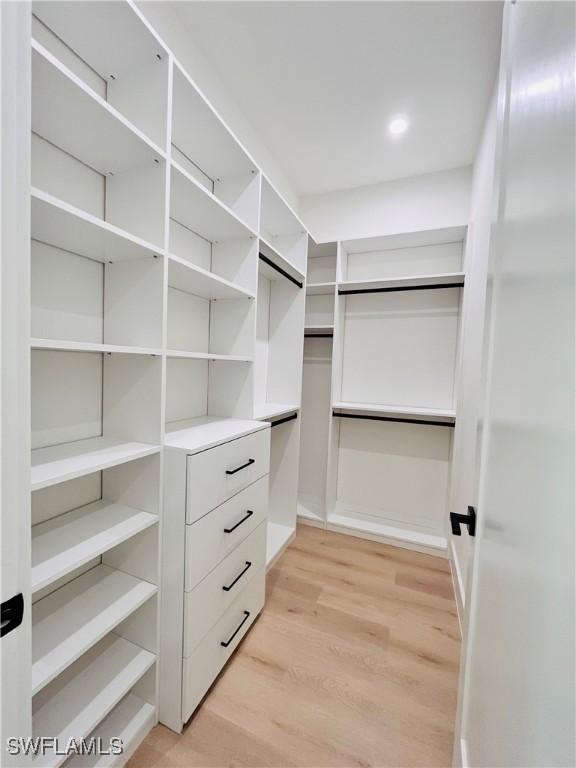 walk in closet featuring light wood-type flooring