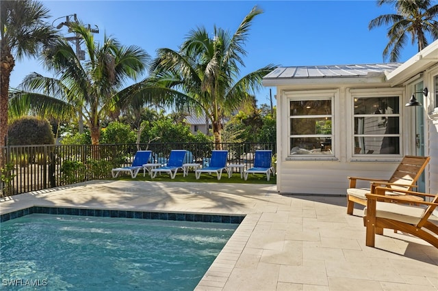 view of swimming pool with a patio area