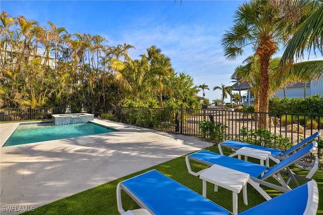 view of swimming pool with a patio area and an in ground hot tub