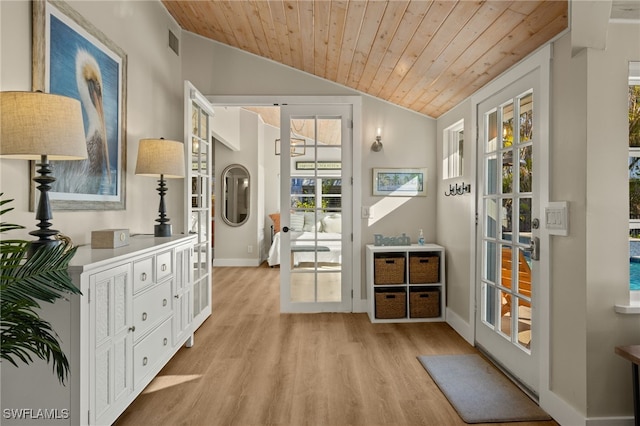 doorway to outside featuring lofted ceiling, wooden ceiling, and light hardwood / wood-style flooring