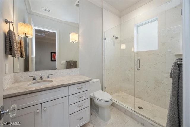 full bathroom with a stall shower, toilet, backsplash, vanity, and visible vents