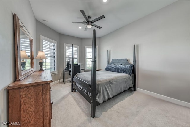 bedroom featuring ceiling fan and light carpet