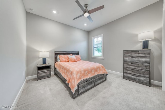 bedroom with light carpet and ceiling fan