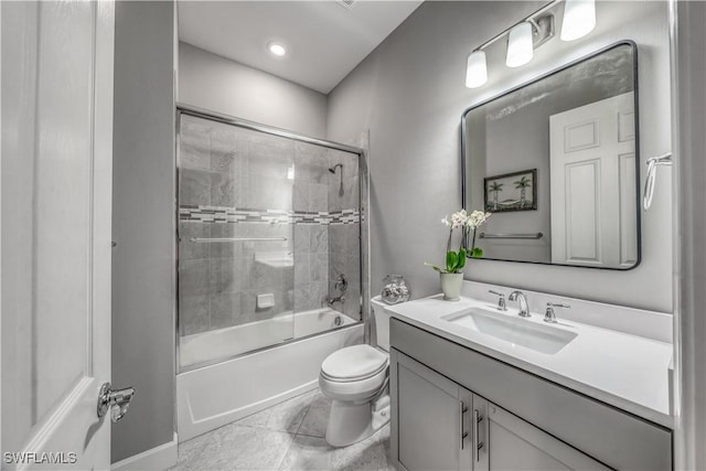 full bathroom featuring toilet, vanity, and shower / bath combination with glass door