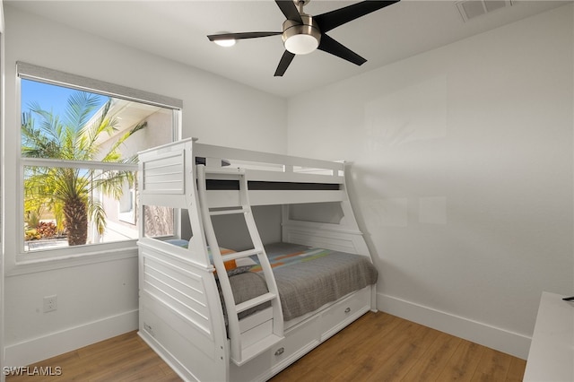 bedroom with ceiling fan and hardwood / wood-style floors