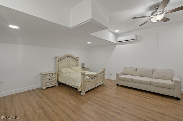 bedroom with wood-type flooring, ceiling fan, and a wall unit AC