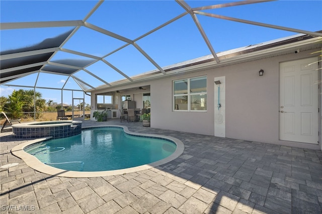 view of swimming pool with a lanai, a patio, and an in ground hot tub