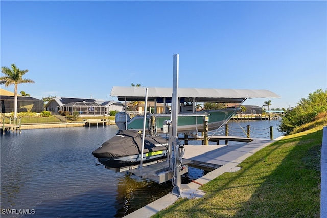 dock area featuring a water view and a lawn