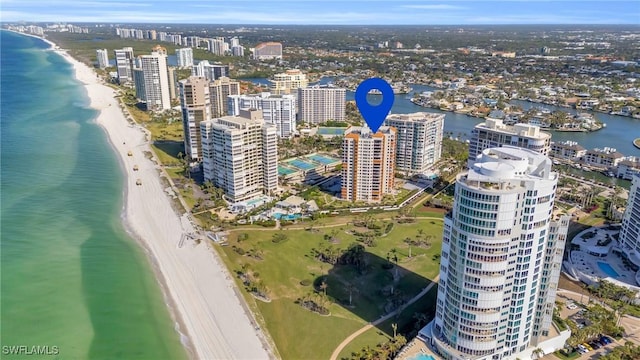 bird's eye view with a water view and a view of the beach