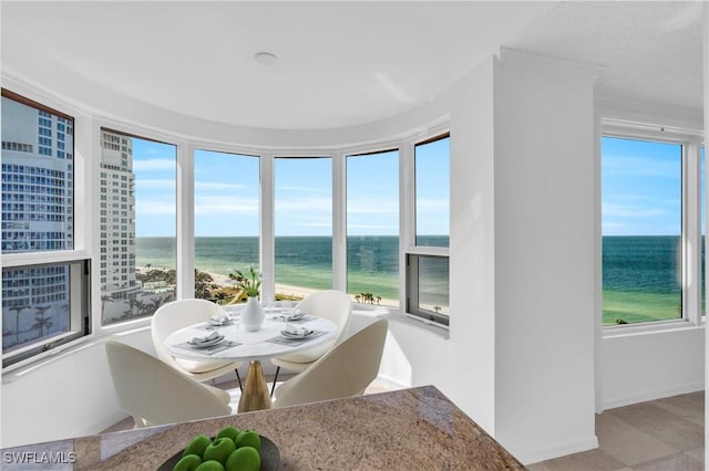 sunroom with a water view