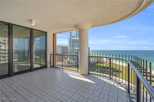 balcony featuring a water view