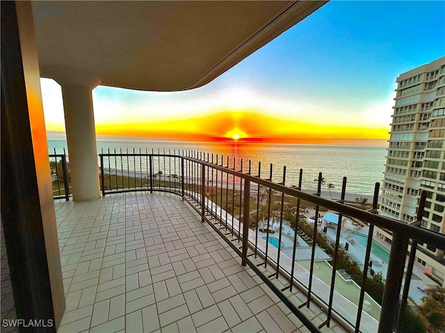 balcony at dusk with a water view