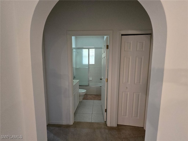 hall with light tile patterned flooring